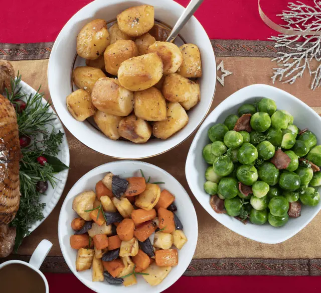 Bowls with food on top of a festive tablecloth