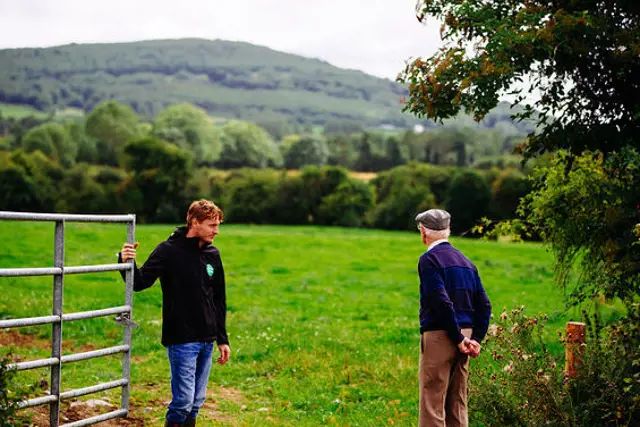 Two farmers at a field