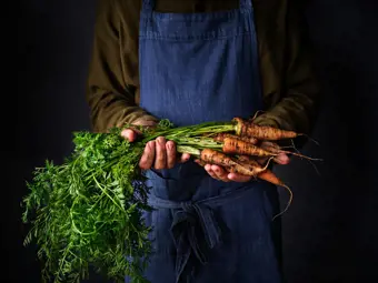 Organic carrots in farmer hands